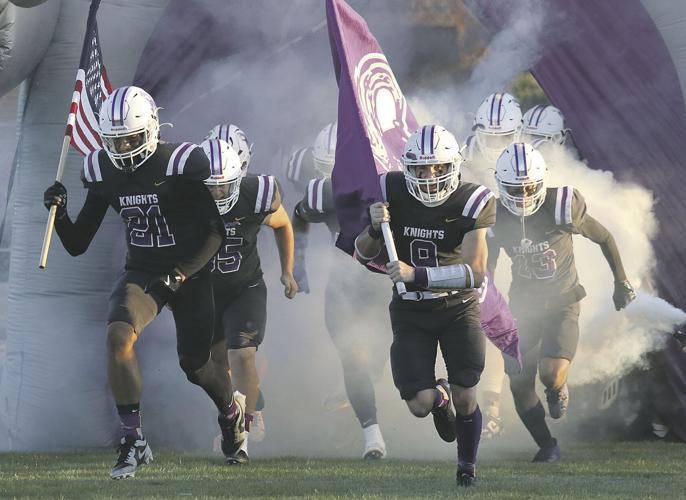  Football Team Running with Flags entering the football field